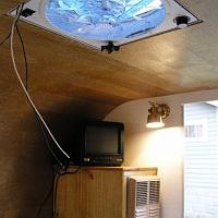  The TV sits on top of the furnace cabinet.