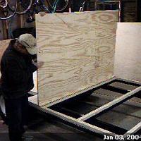  Gluing the plywood down to the subfloor.