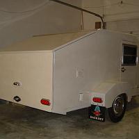  The trailer was covered in Epoxy, sanded, primed, sealed, painted with a base, pearl, clear coat.